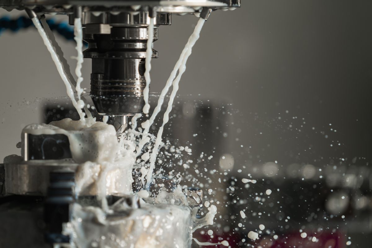 CNC precision machining with cutting fluid